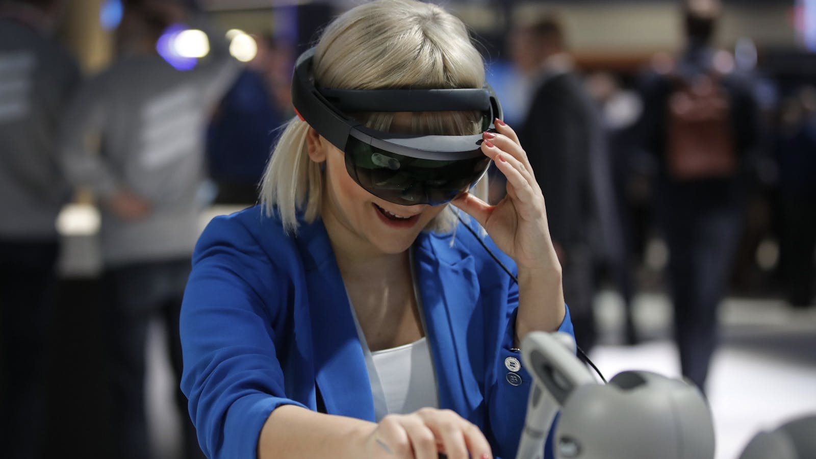 An attendee at Mobile World Congress in Barcelona this year wearing a Microsoft Hololens AR headset. Photo by Bloomberg
