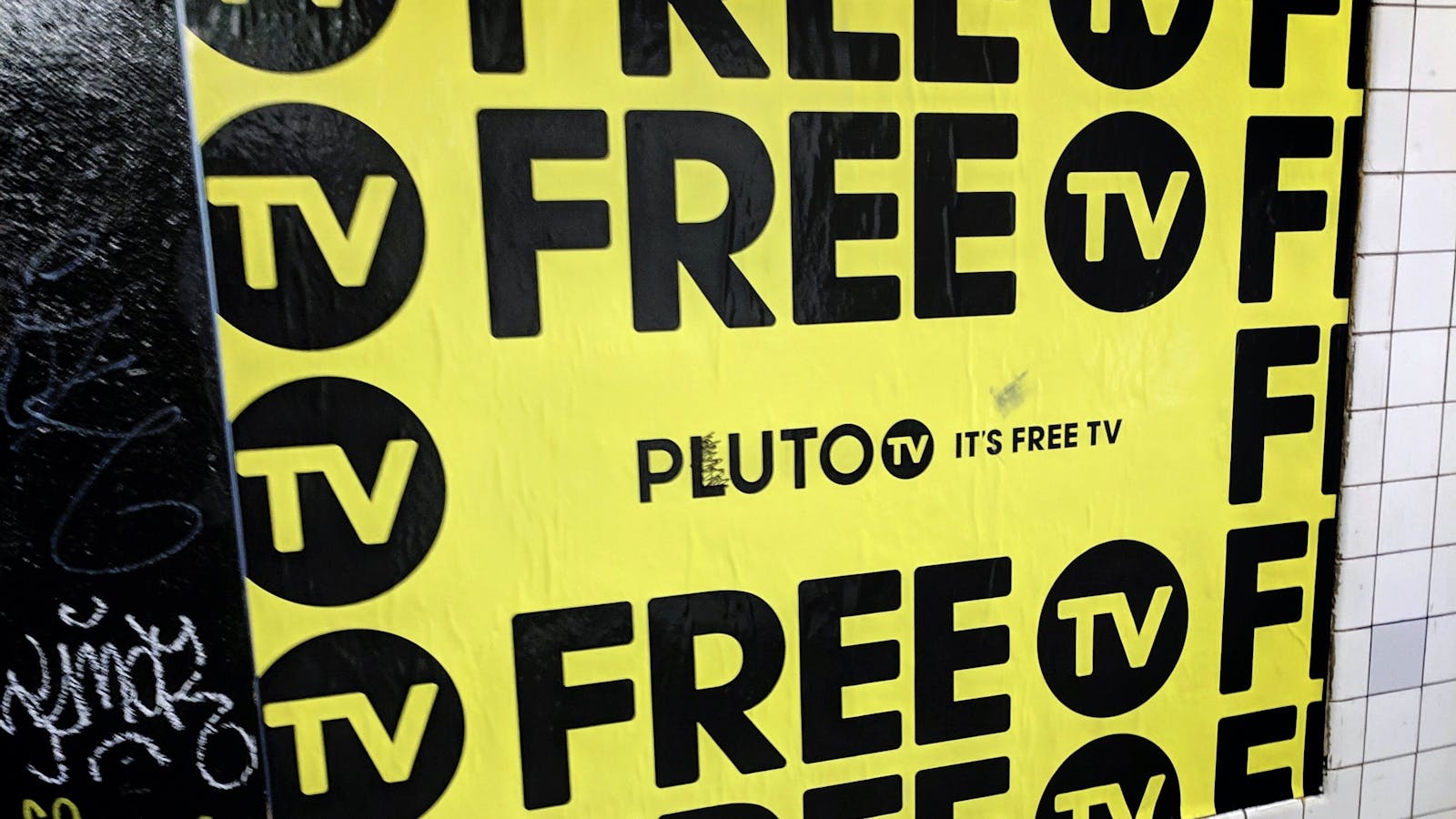 An ad for Viacom's Pluto TV service on a New York subway wall earlier this year. Photo by AP