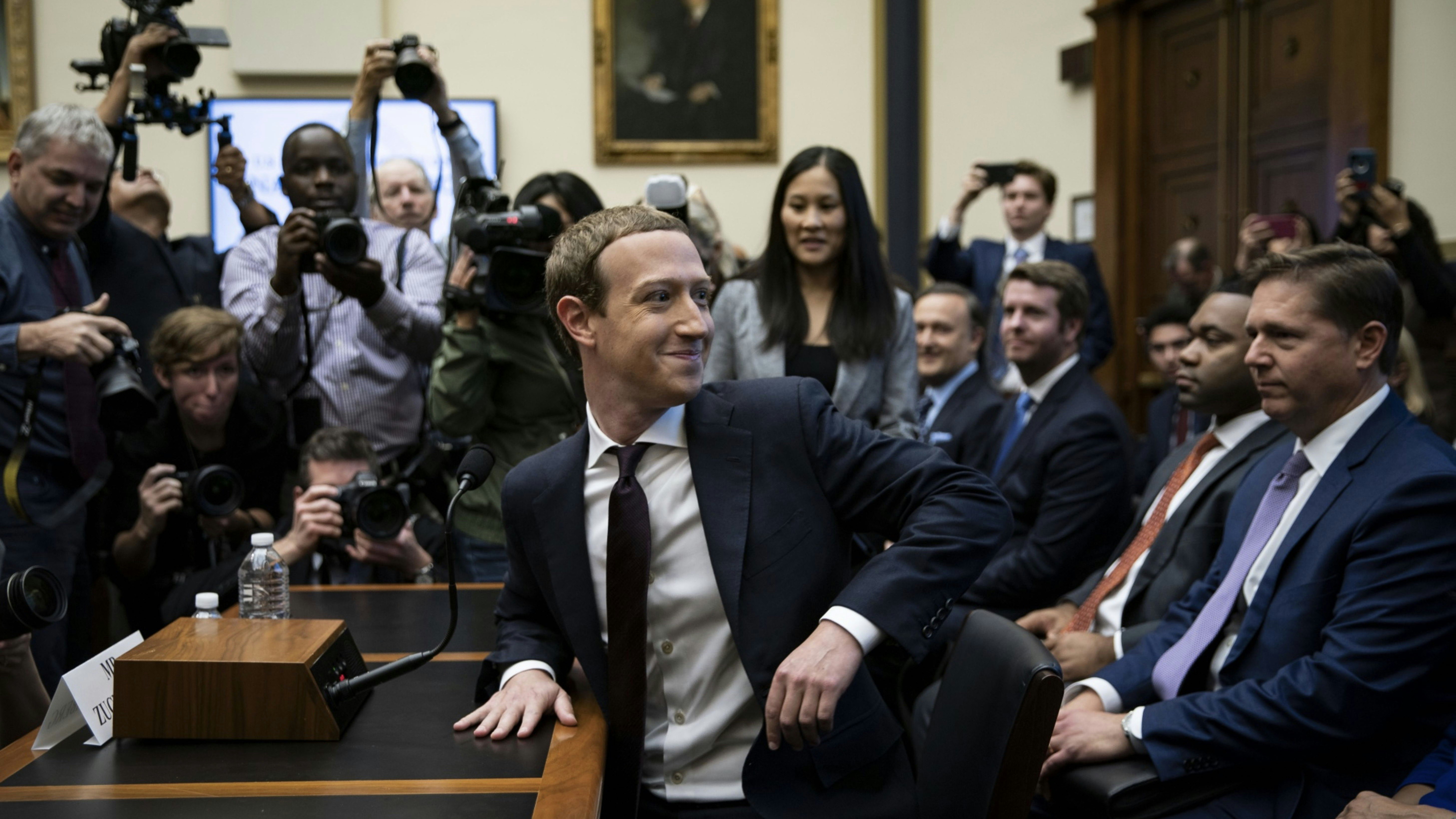 Facebook CEO Mark Zuckerberg at a congressional hearing last year. Facebook's U.S. public policy vice president Kevin Martin is sitting behind him. Photo by Bloomberg