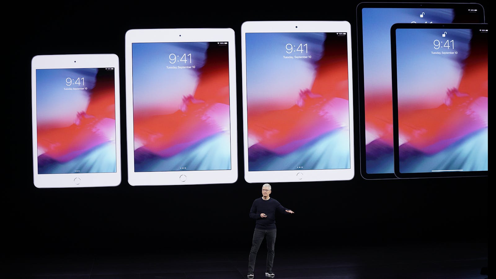 Apple CEO Tim Cook unveiling a new line of iPads last year.  Photo by AP