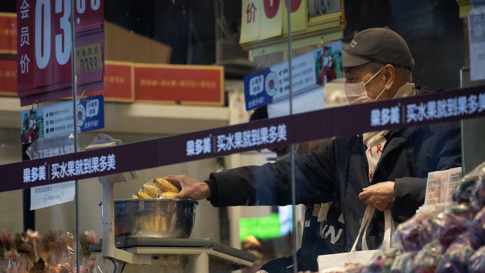 A shopper in Beijing in February. Photo by AP