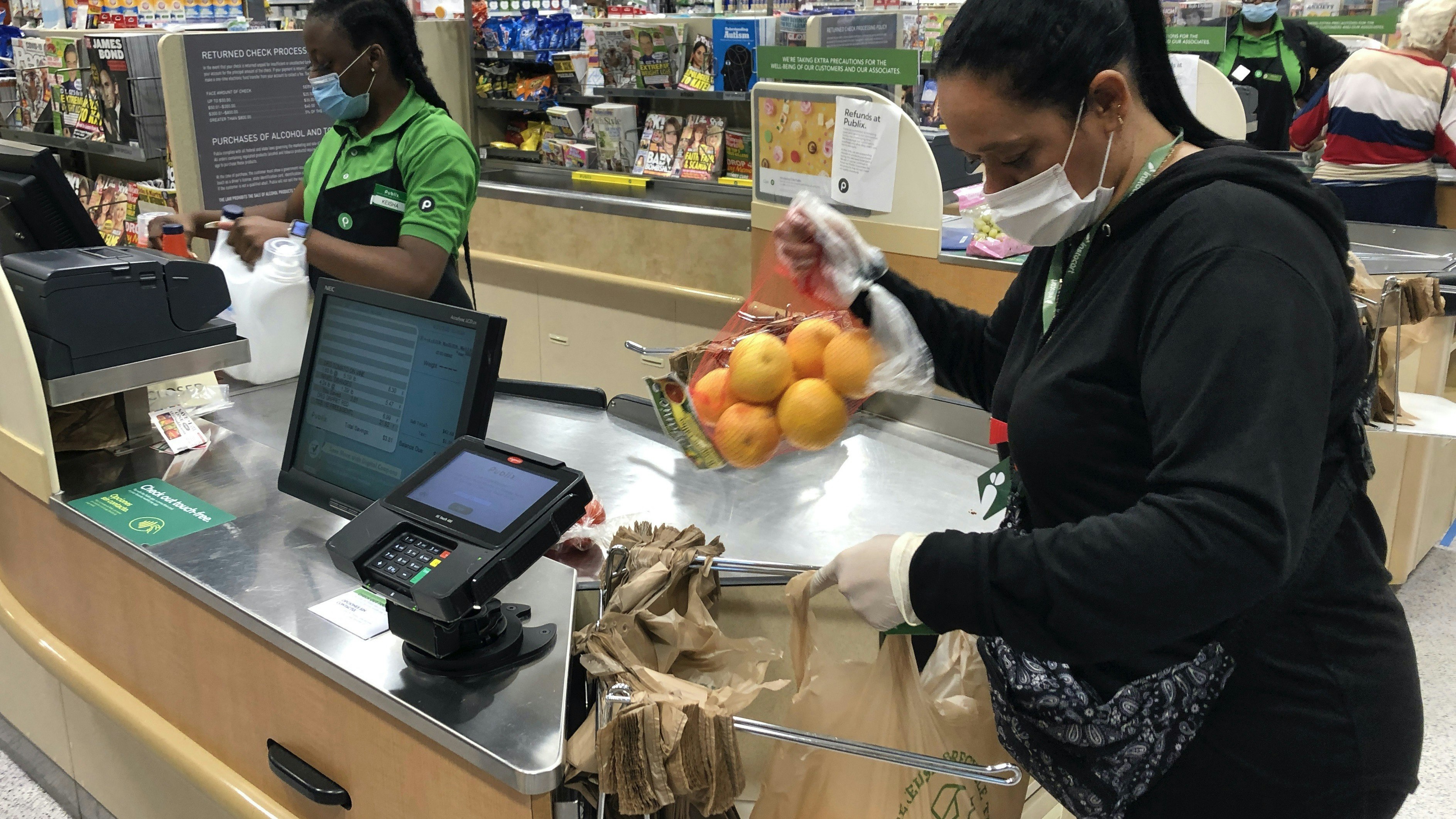 Yelitza Esteva, a contractor for Instacart, bagging groceries for an order in Florida this month. Photo by AP
