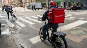 A DoorDash delivery person in New York City in March. Photo by Shutterstock