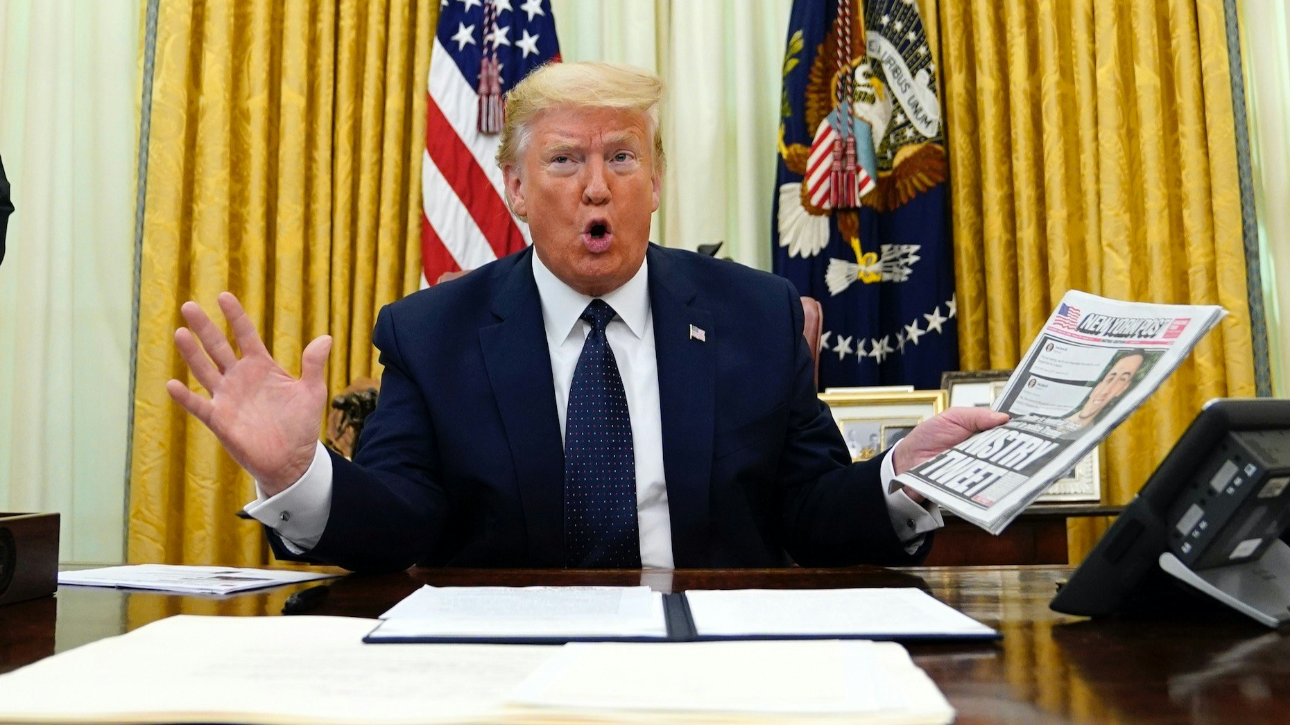 President Trump in the Oval Office on Thursday before signing the executive order on social media. Photo: AP