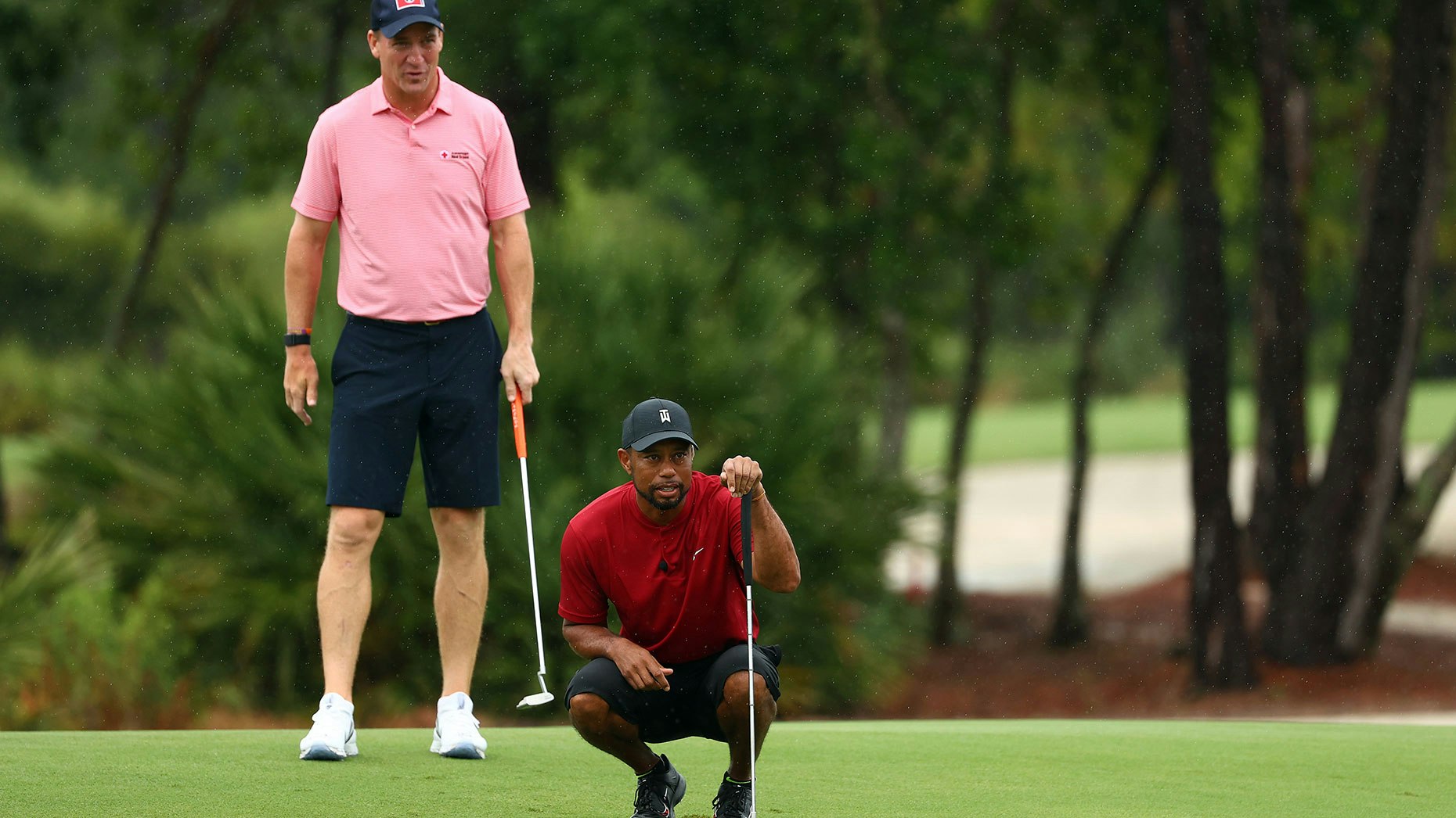 Tiger Woods and Peyton Manning during last month's charity tournament that drew heavy betting. Photo by Getty Images/Mike Ehrmann