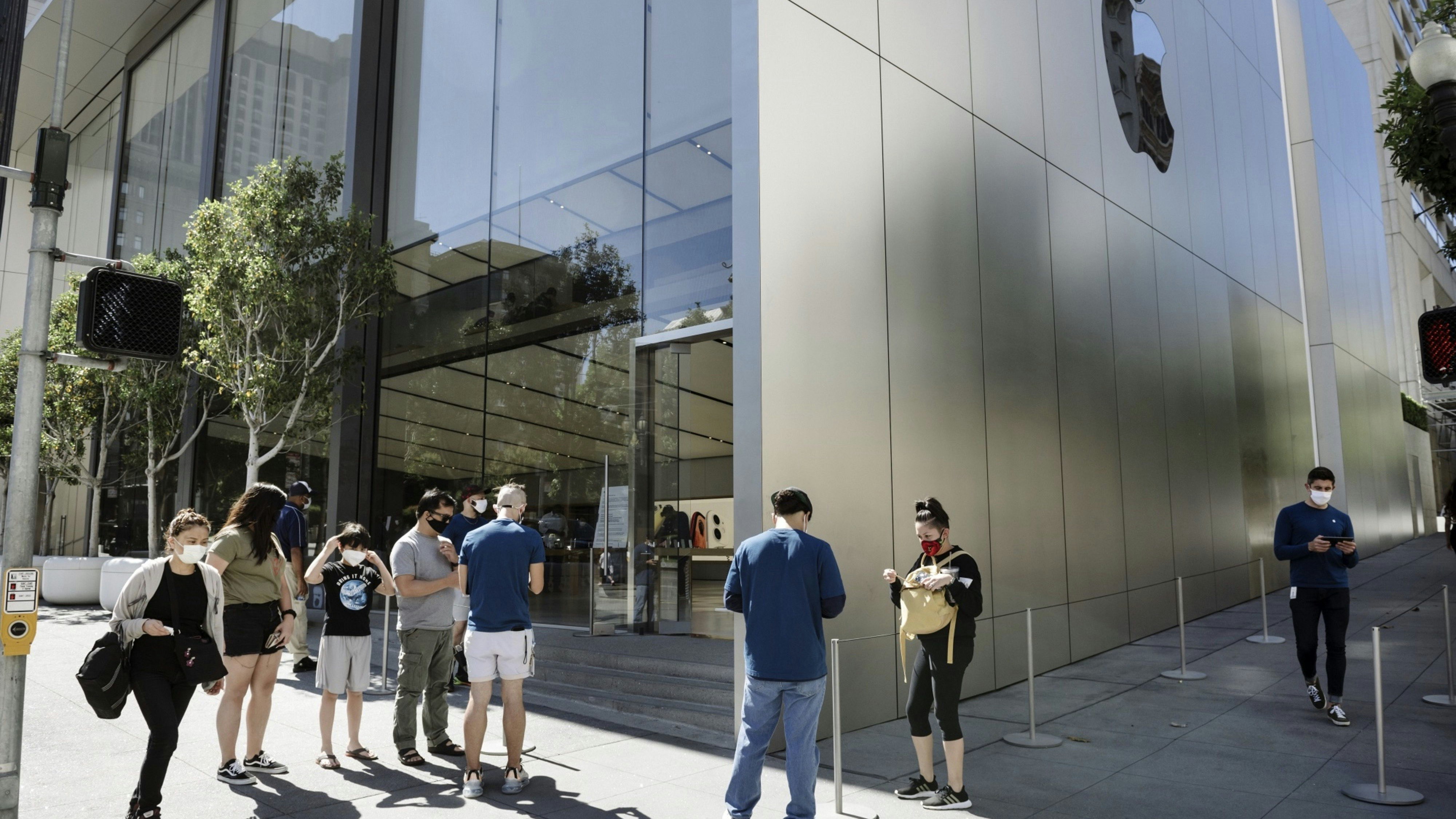 Customers checking into an Apple store in San Francisco in June. Photo by Bloomberg