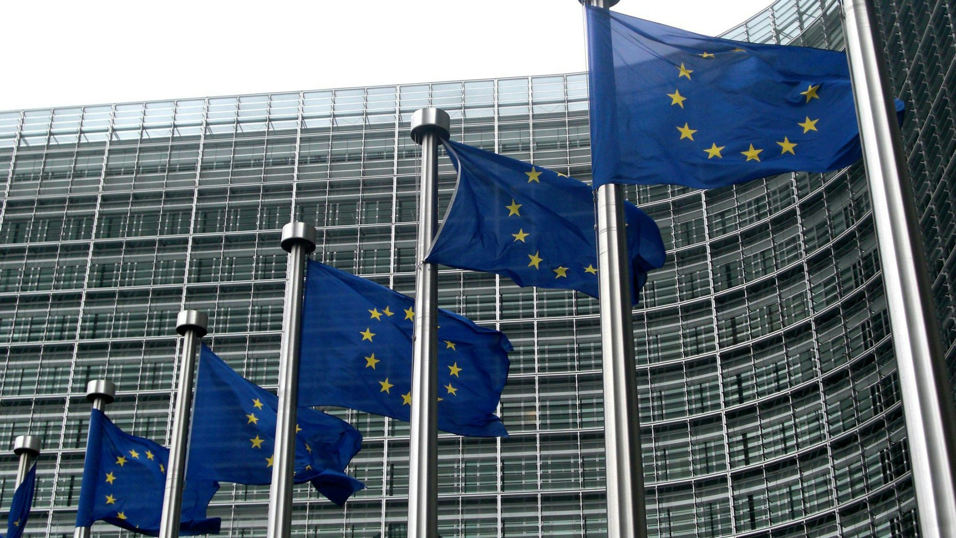 EU flags outside of the European Union Commission building in Brussels.  