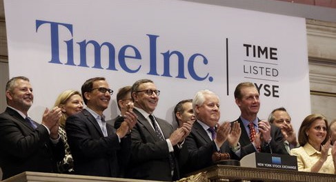 Time executives on the company’s first day of trading this year. Photo by Associated Press.