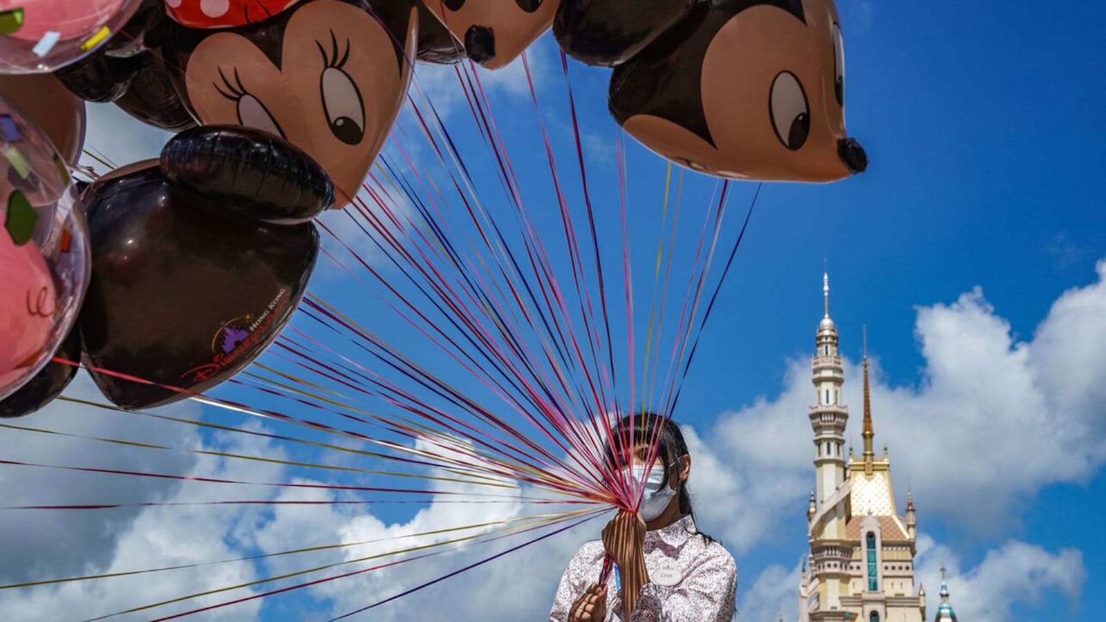 An  employee at Walt Disney Co.'s Disneyland Resort in Hong Kong on June 18. Shutdowns resulting from the coronavirus contributed to a $4.7 billion quarterly loss. 