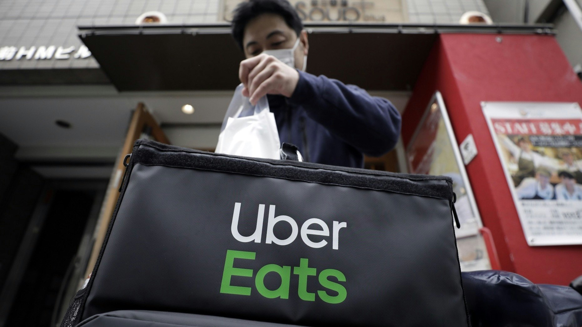 An Uber Eats delivery courier  in Tokyo on  April 21. Photo: Bloomberg