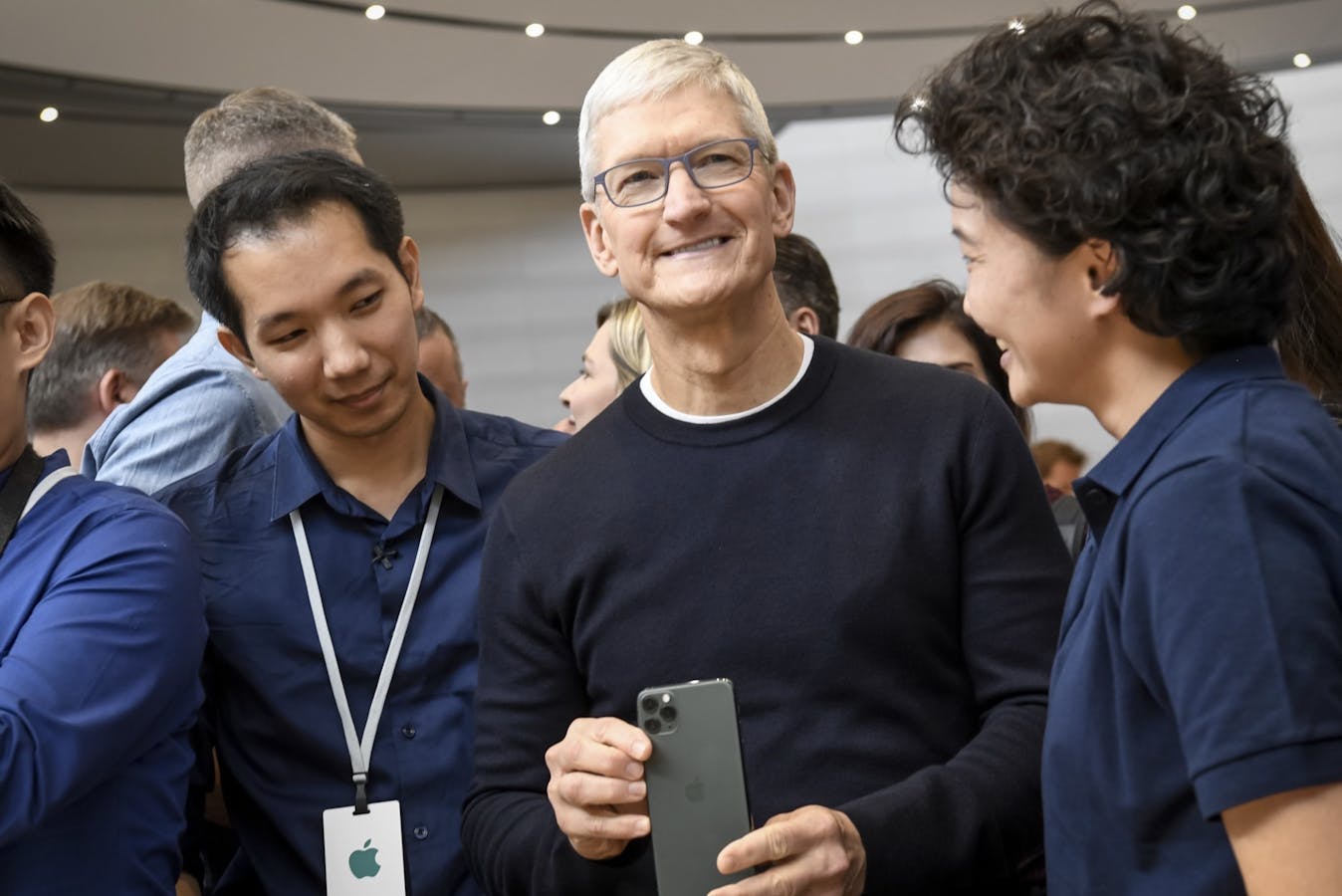 Apple CEO Tim Cook holds the iPhone 11 Pro after an event unveiling it last September. Photo by Bloomberg