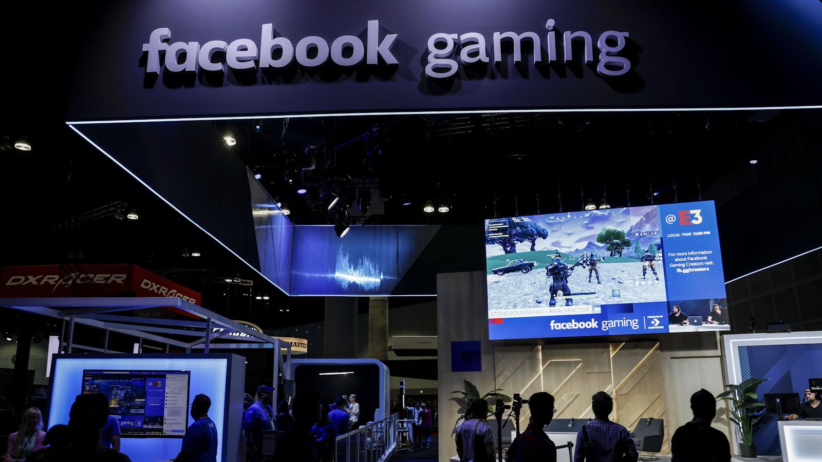 Attendees watching a video game streamed at Facebook Gaming's booth during the 2018 Entertainment Expo show in Los Angeles. Photo by Bloomberg