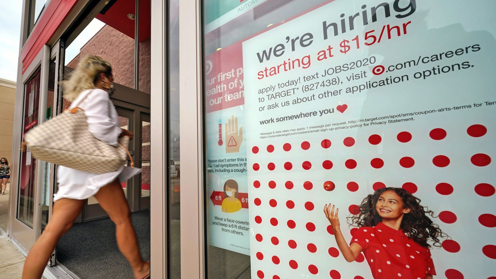 A help wanted sign hangs on the door of a Target store in Uniontown, Pa. Photo: AP