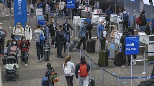 Travelers at San Francisco Airport. Photo by Bloomberg