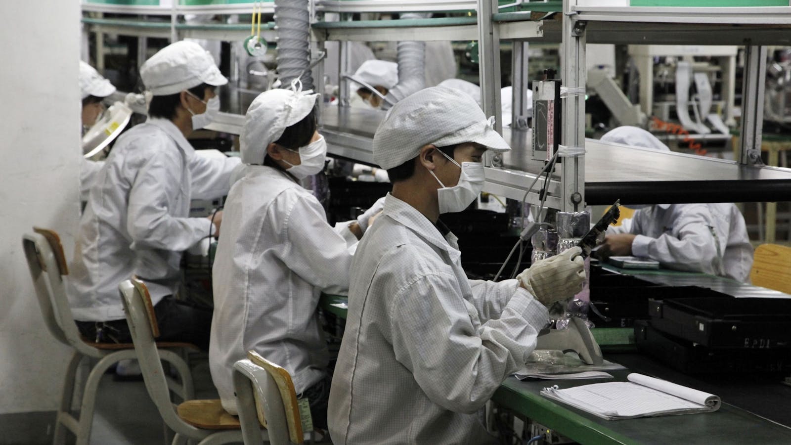Workers at a Foxconn assembly line in Shenzhen, China. Photo by Bloomberg