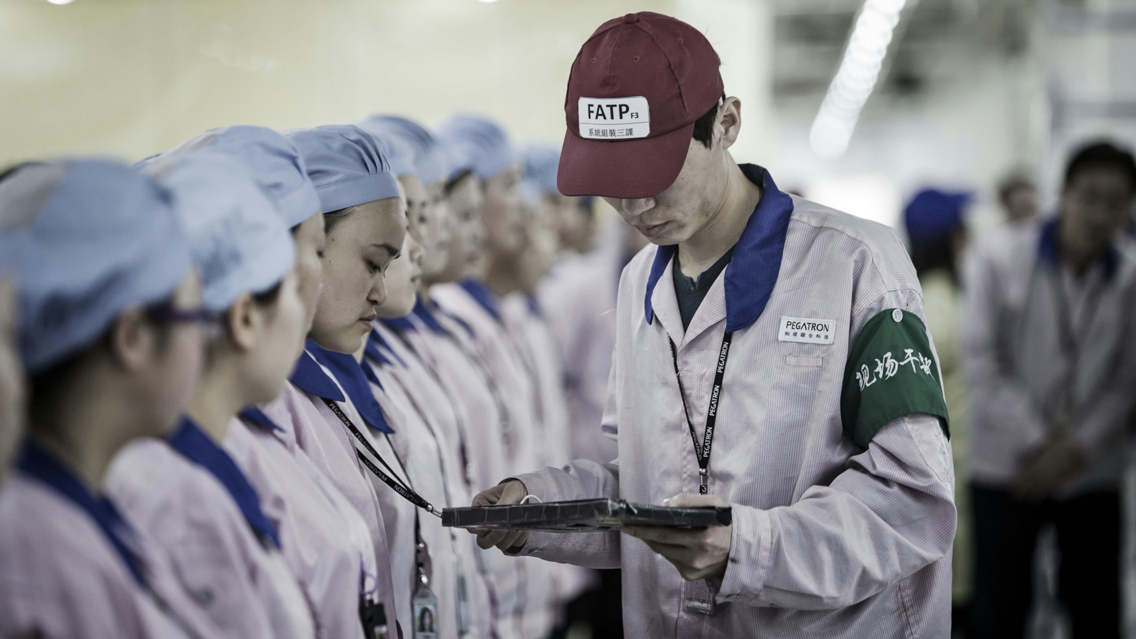 Workers at a Pegatron Corp. factory in Shanghai, China in 2016. Photo by Bloomberg