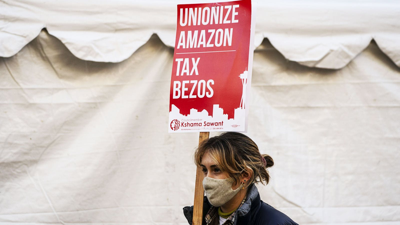 A demonstrator protesting outside Amazon's headquarters in Seattle in November. Photo by Bloomberg