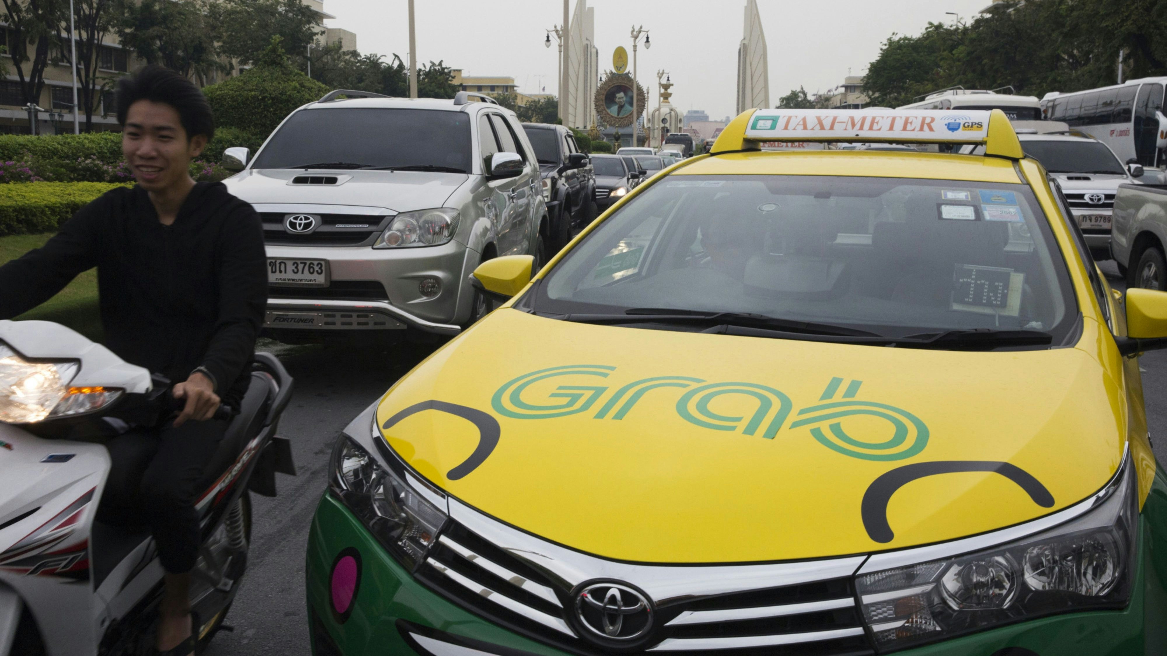 A Grab taxi. Photo by Bloomberg.