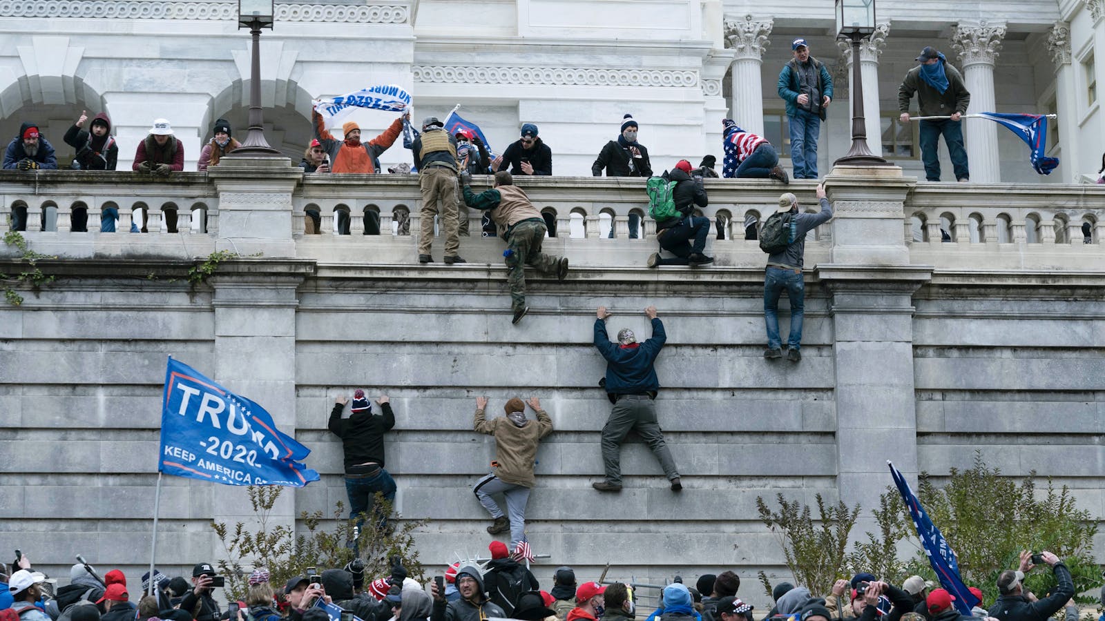 Protesters storming the Capitol building. Photo by AP