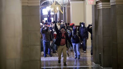 Rioters breached barricades to enter the U.S. Capitol on Jan. 6. Photo: Bloomberg