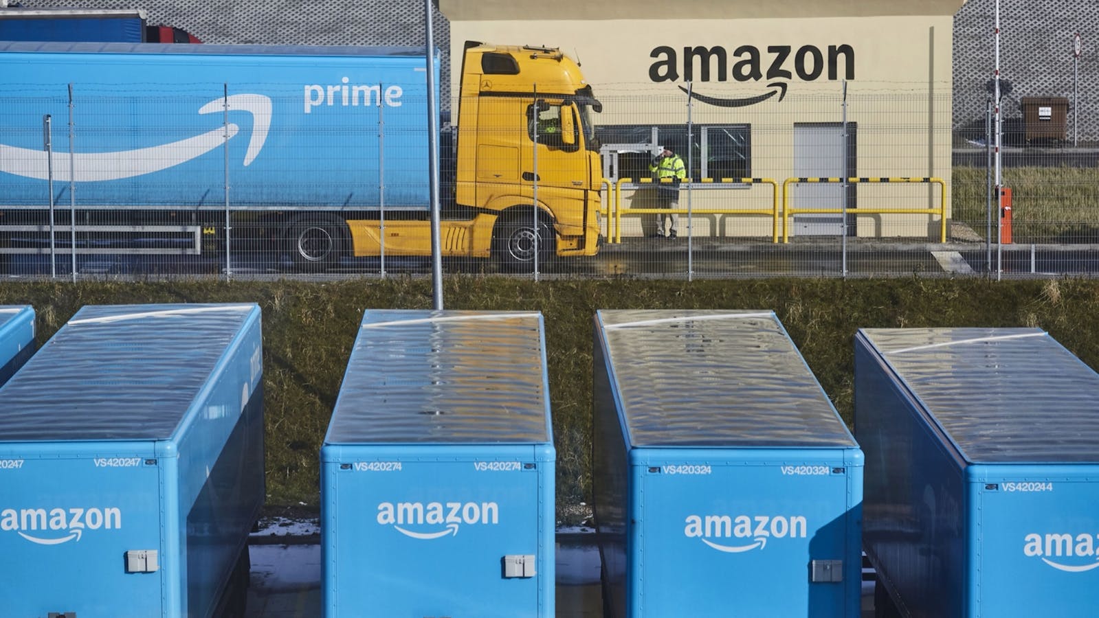 A truck and trailers outside an Amazon fulfillment center in Poland. Photo by Bloomberg