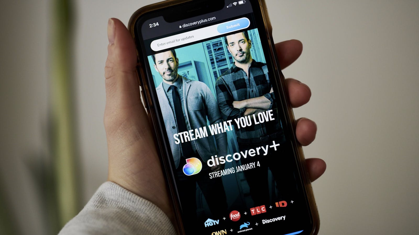 The Discovery+ home screen on a smartphone. Photo by Bloomberg