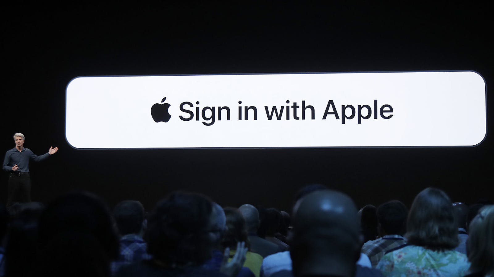 Craig Federighi, Apple's senior vice president of software engineering, unveils Apple's sign-in button in 2019. Photo by AP.