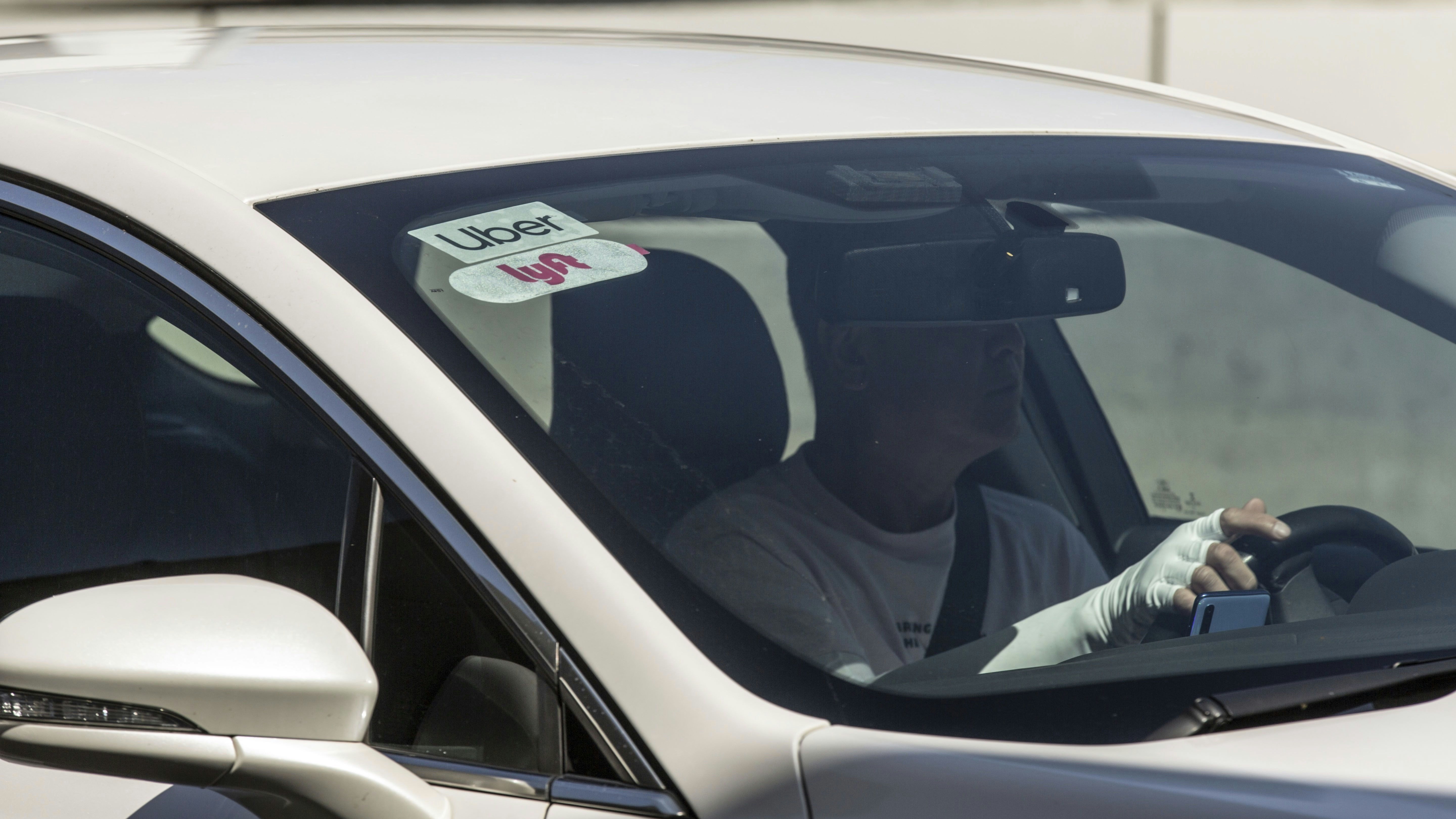 An Uber and Lyft driver. Photo by Bloomberg.