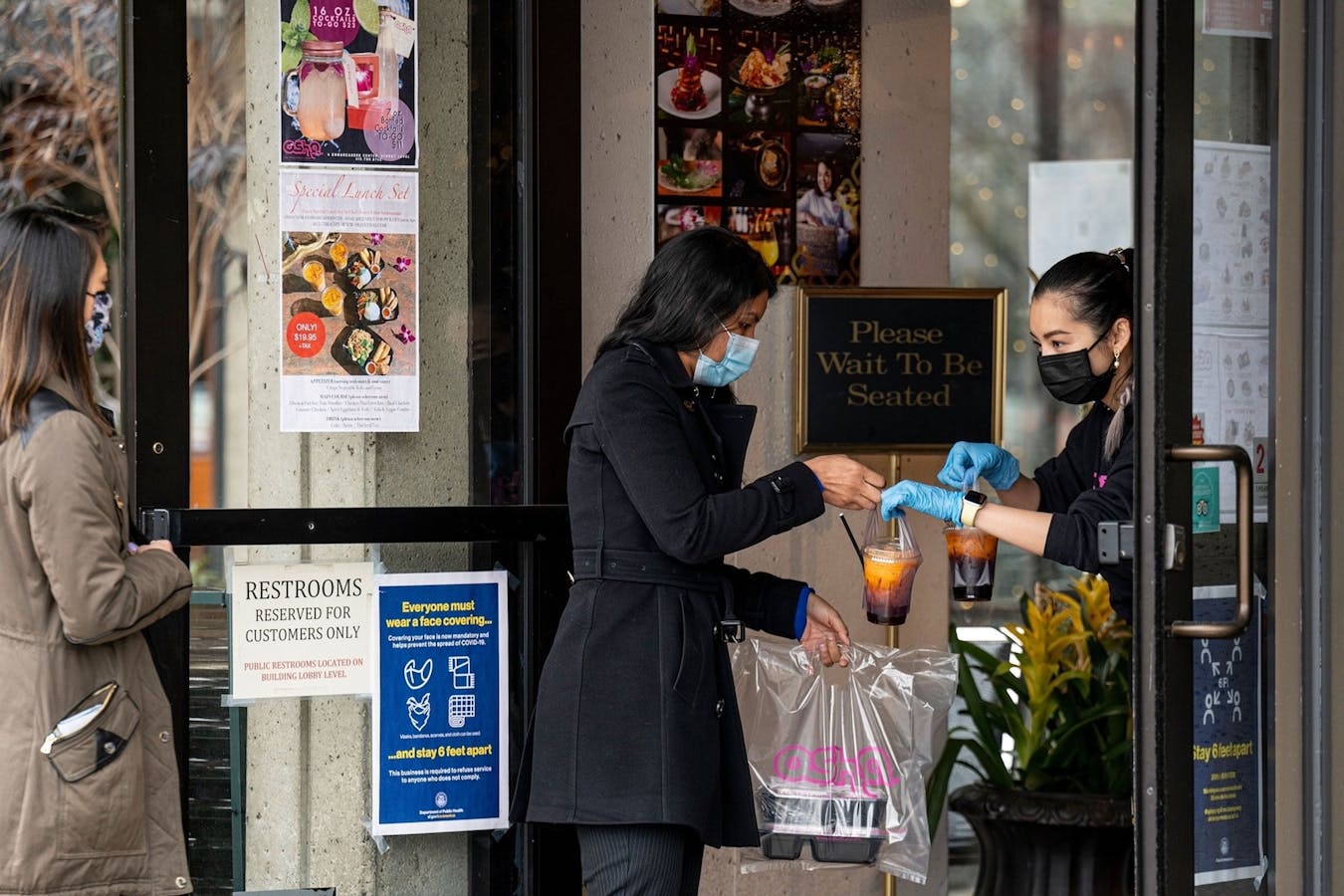 A restaurant in San Francisco serves a take-out customer in February. Startups that help restaurants take online orders have flourished during the pandemic. Photo: Bloomberg
