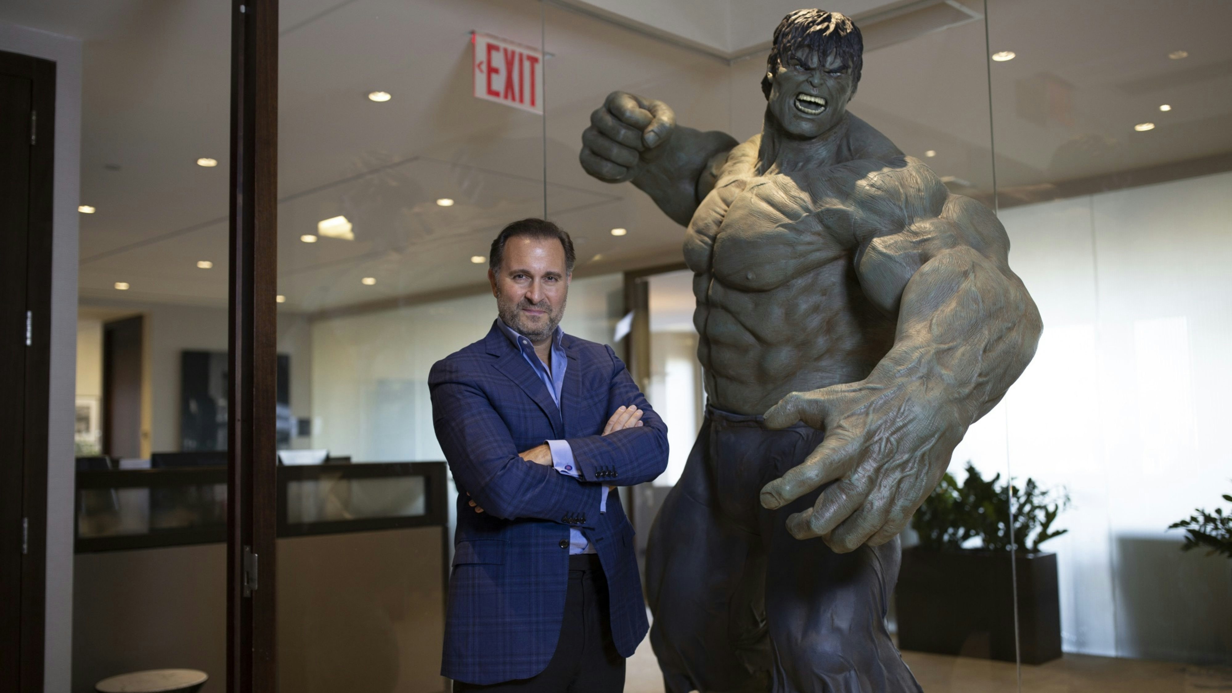 Redbird's Gerry Cardinale next to a statute of the Incredible Hulk. Photo by Bloomberg