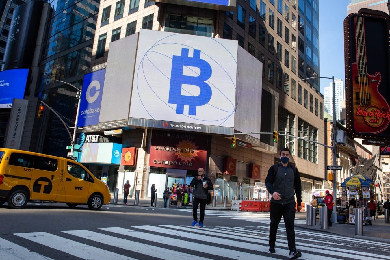 Coinbase and Bitcoin signage in New York this April. Photo by Bloomberg