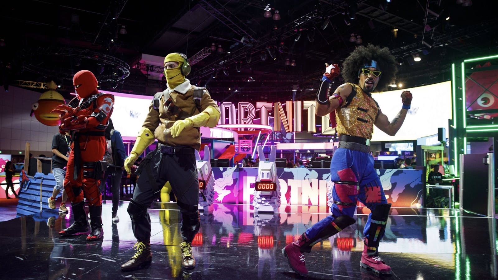 Character actors from Fortnite  dance during the E3 Electronic Entertainment Expo in Los Angeles in 2019. Photo by Bloomberg.