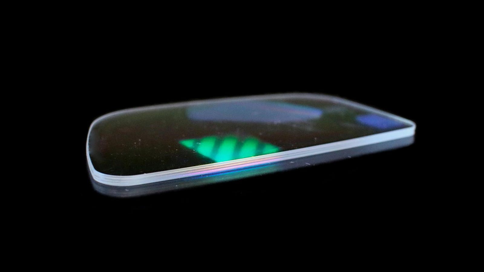 A waveguide lens, photographed showing a hint of the holographic coating. Photo: DigiLens