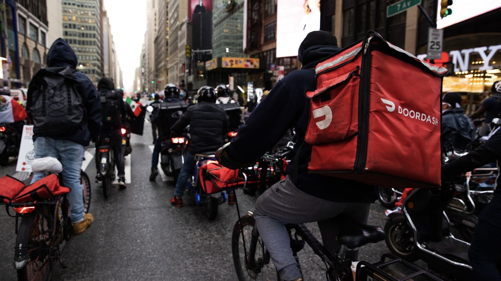 DoorDash riders in New York in April. Photo by Bloomberg.