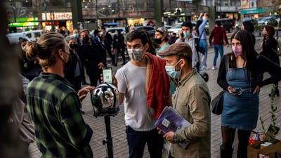 A photo of Worldcoin operators and the orb device in Chile. Photo: Worldcoin.