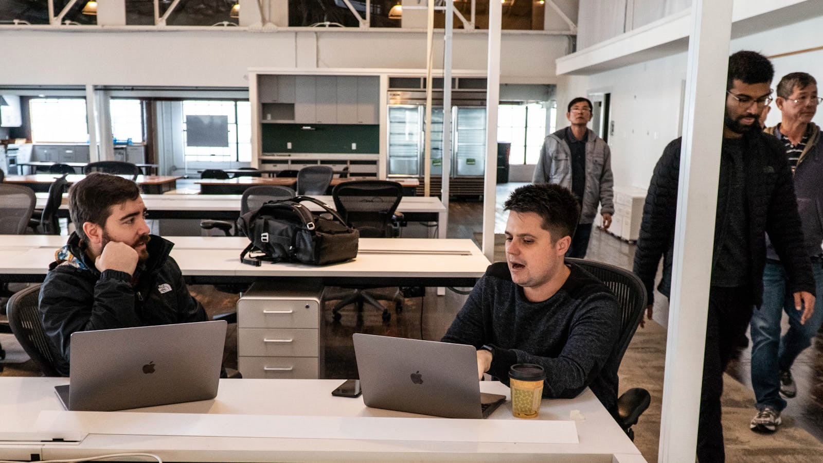 Fast CEO Domm Holland (center) at his office. Credit: Fast