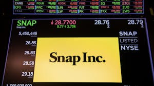 A stock exchange monitor with Snap's share price in March. Photo by Bloomberg.