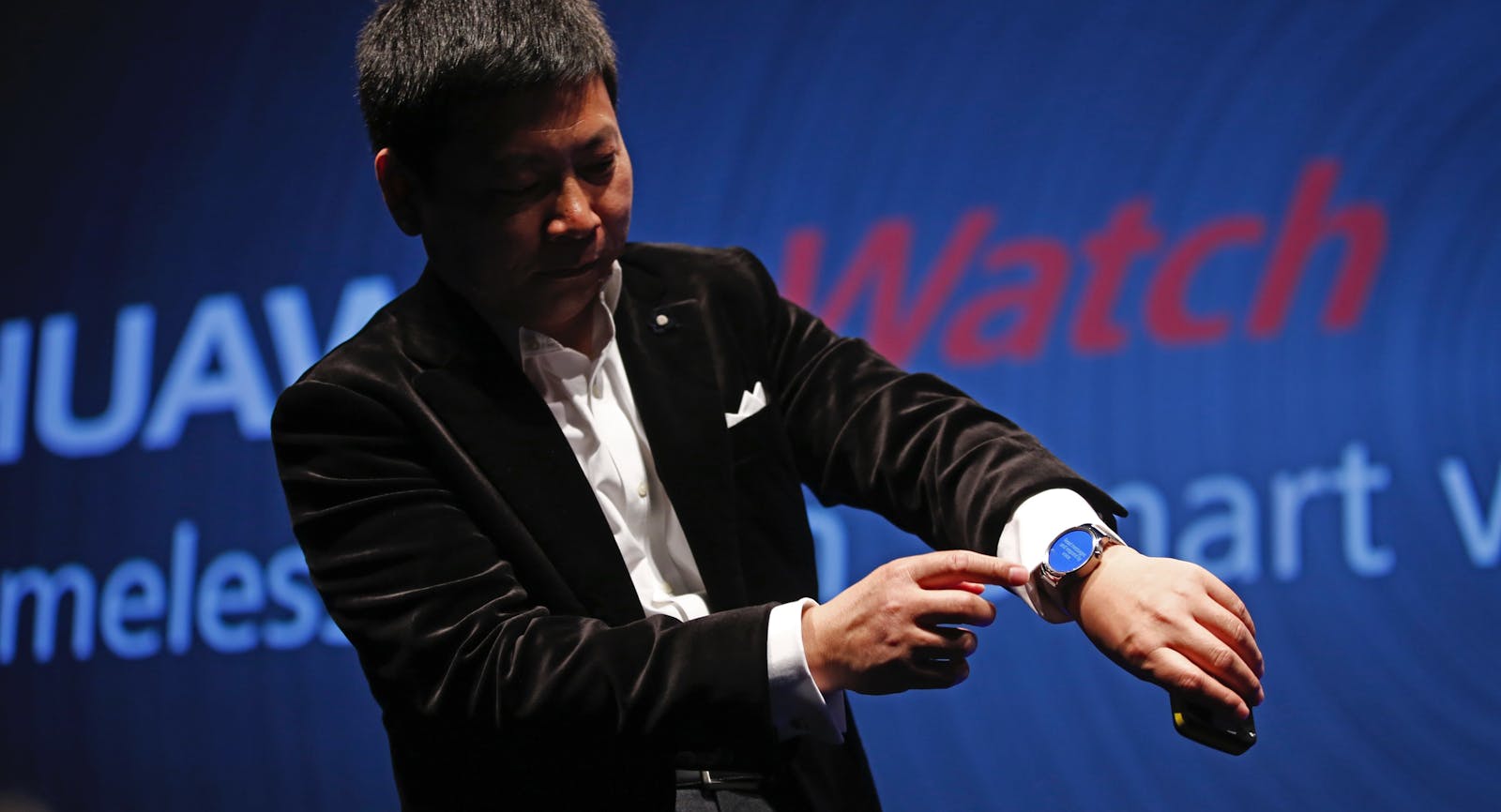 Huawei device group head Richard Yu with the smartwatch. Photo by Bloomberg.