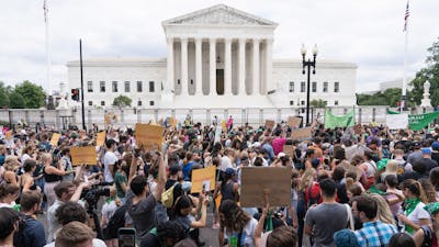 Protesters at the Supreme Court today. Photo by AP