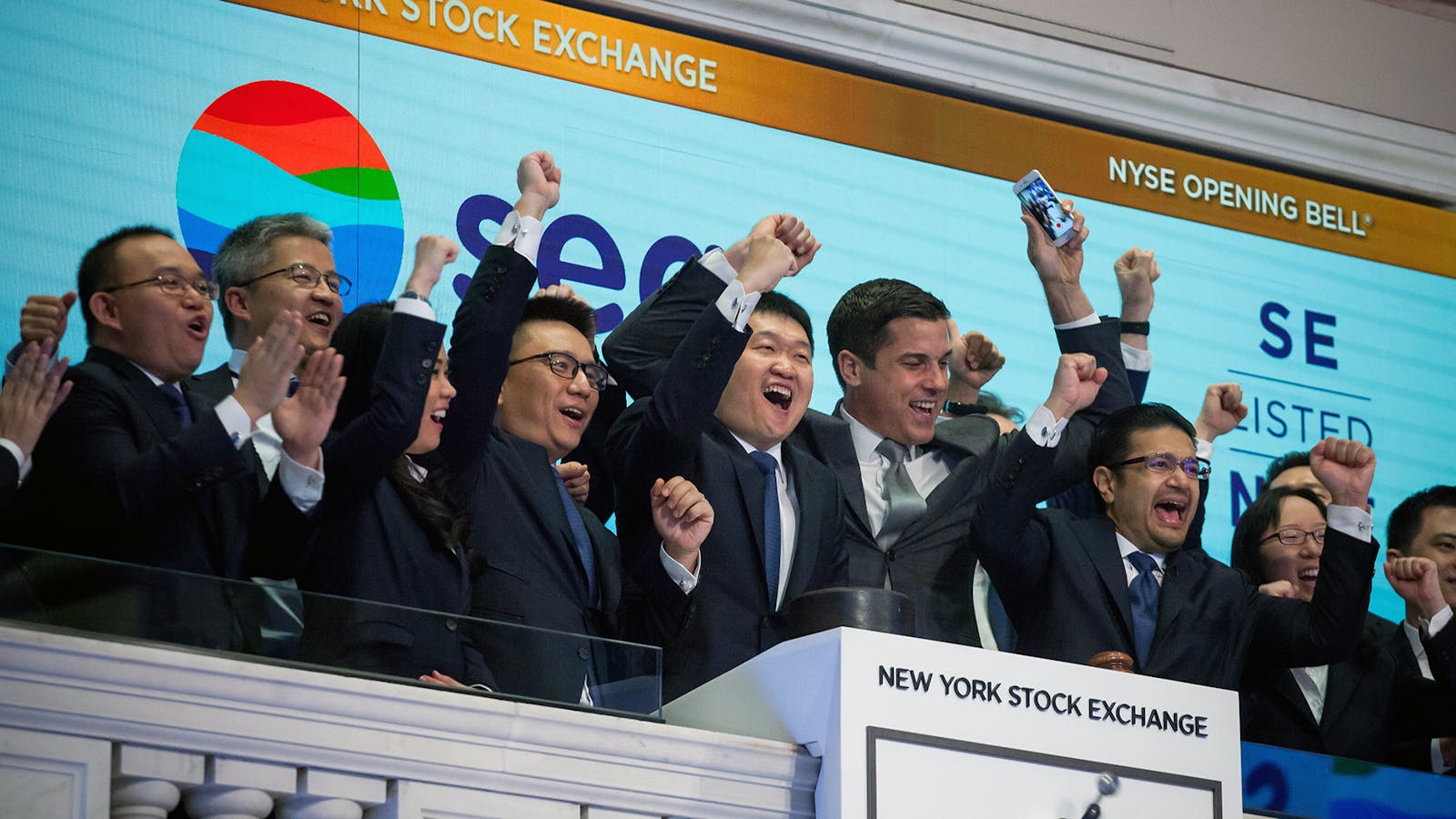 Sea executives when the stock began trading on the New York Stock Exchange. Photo by Getty.