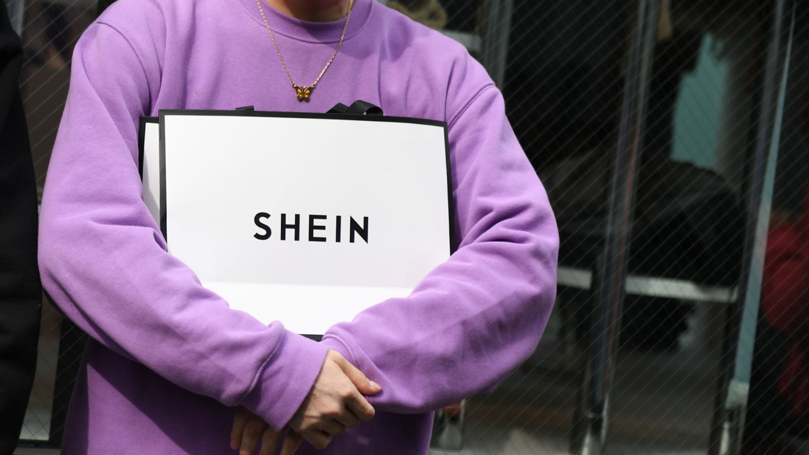 A customer holds a Shein bag outside Shein's Tokyo showroom. Photo by Bloomberg.